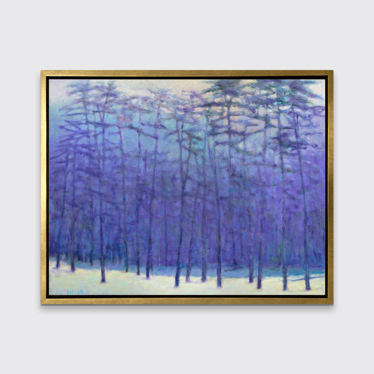 A blue, purple, light pink and soft yellow impressionistic landscape print in a gold floater frame hangs on a white wall.
