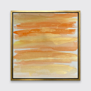 A orange, gold and white abstract print in a gold floater frame hangs on a white wall.
