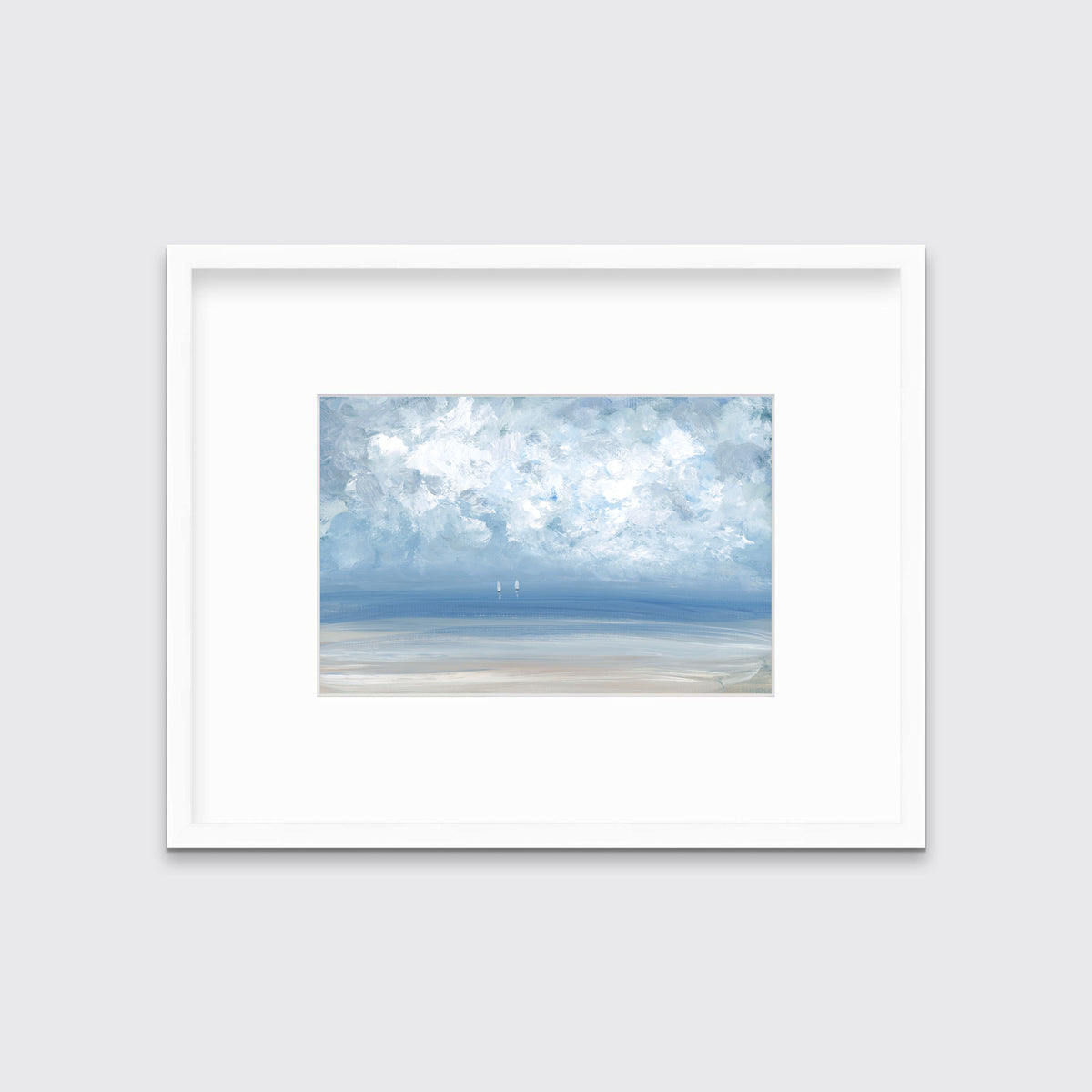 A white, blue and beige abstract seascape print in a white frame with a mat hangs on a white wall.