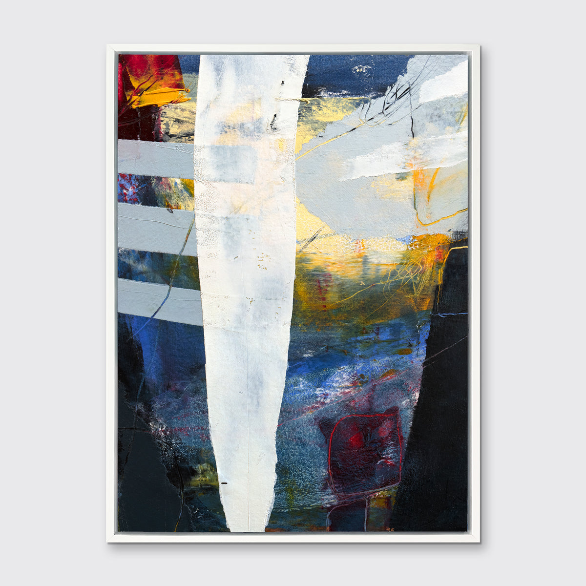A white, yellow, red and grey abstract print in a white floater frame hangs on a white wall.