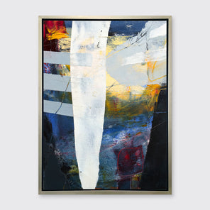 A white, yellow, red and grey abstract print in a silver floater frame hangs on a white wall.