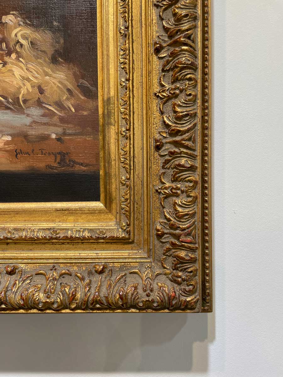 Detailed, close up from the corner of the gold frame.