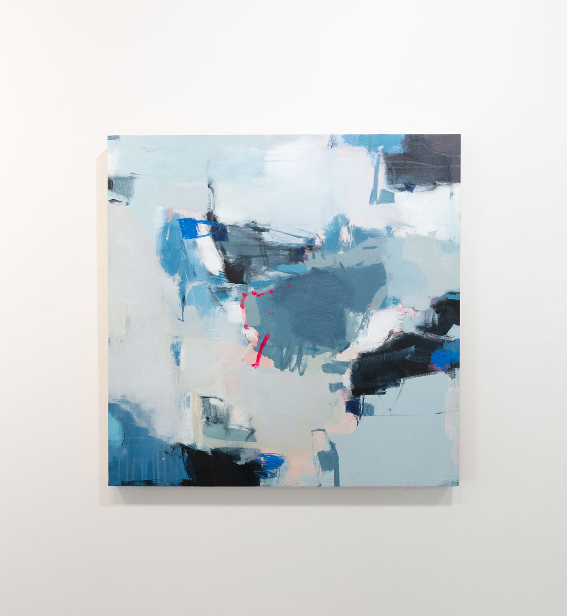 A blue, white and black abstract painting by Kelly Rossetti hangs on a gallery wall.