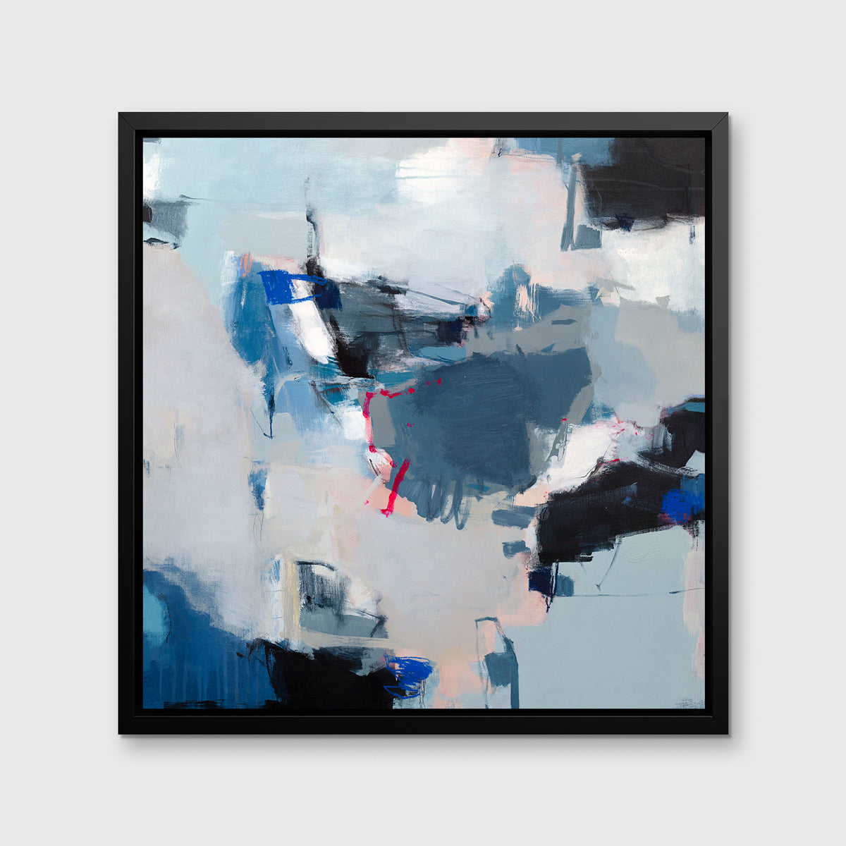 A blue, white and black abstract print in a black floater frame hangs on a white wall.