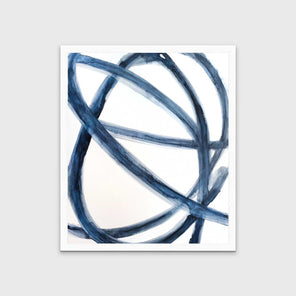 A blue and white abstract print in an unmatted white frame hangs on a white wall.