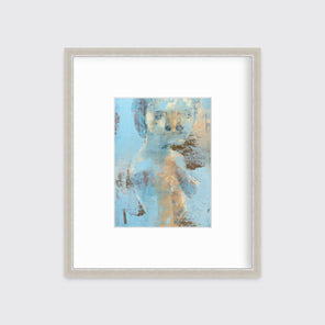A light blue, copper and beige abstract figural print in a silver frame with a mat hangs on a white wall.