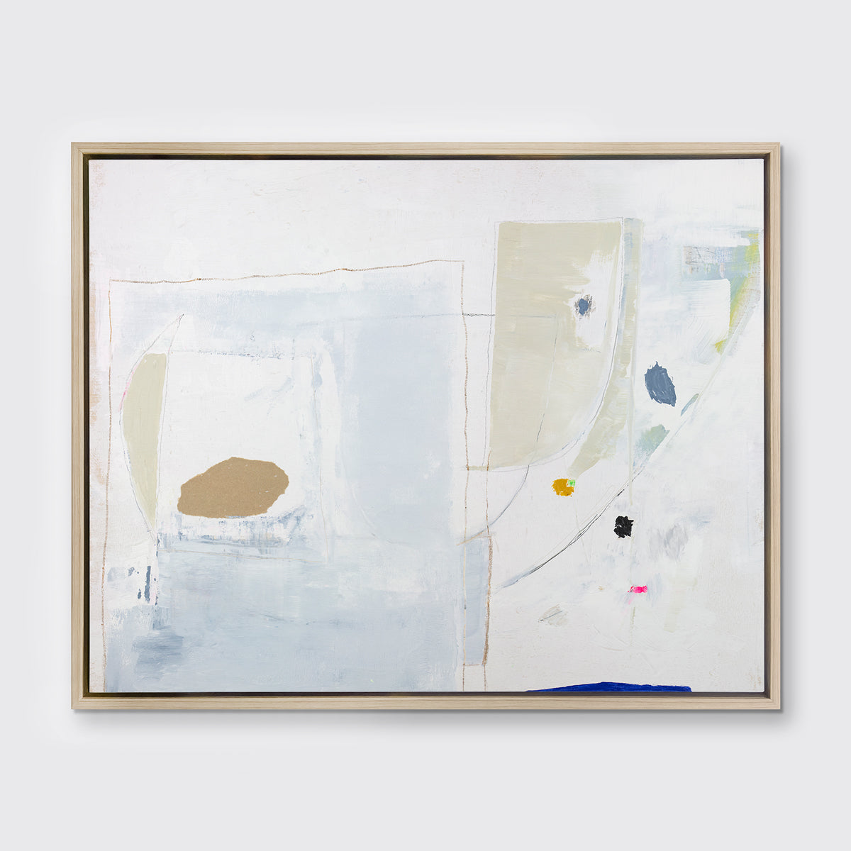 A white, blue, beige and light green abstract print in a white oak wood floater frame hangs on a white wall.