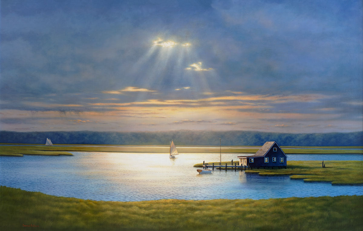 A contemporary realist painting of a scene of a bay house on a cloudy day with two sailboats and sunlight shining through the clouds onto the house at the center of the painting. 