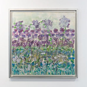 An abstract, encaustic floral painting of purple irises by Linda Bigness hangs on a gallery wall.