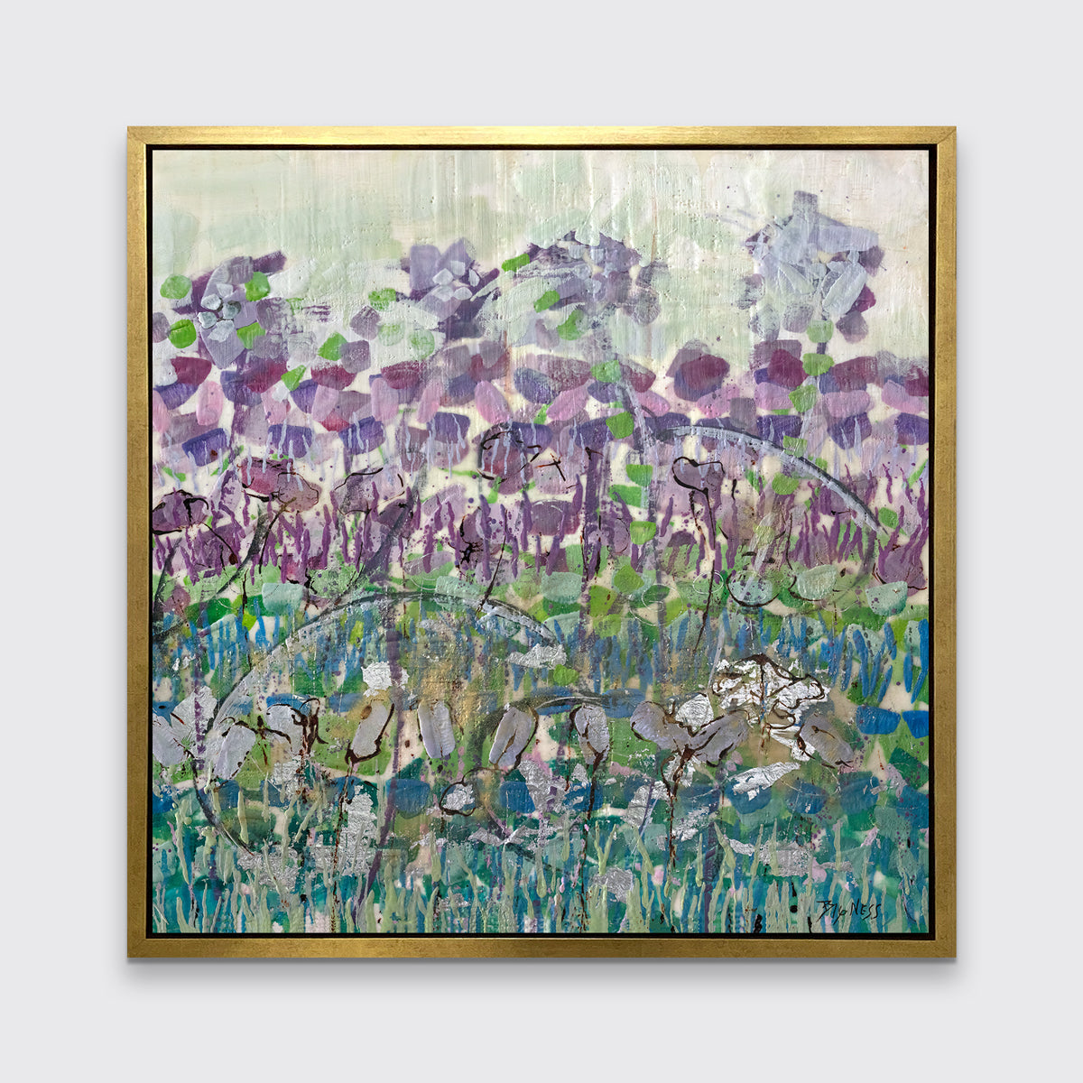 A purple, blue and green abstract floral print in a gold floater frame hangs on a white wall.