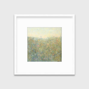 A yellow-green abstract landscape in a white frame with a mat hangs on a white wall.