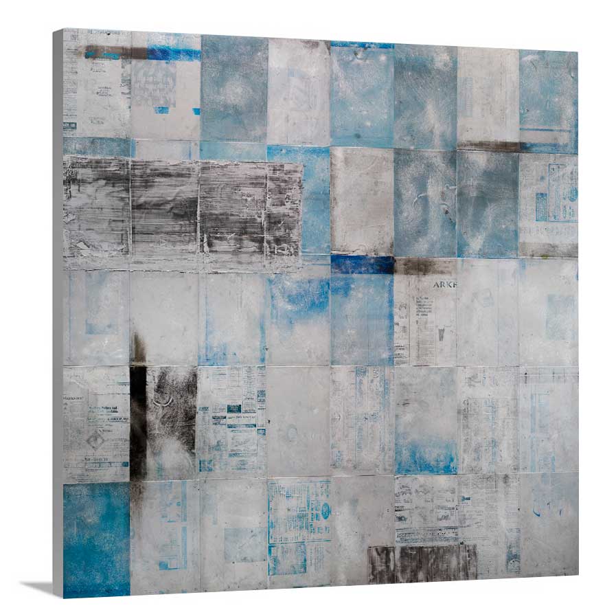 A side-angle view of a blue, grey and black abstract print on canvas.