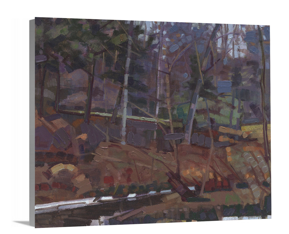 A side-angle view of a brown, grey and green abstract landscape print on canvas.