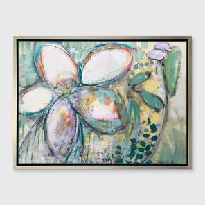 An abstract floral print in a silver floater frame hangs on a white wall.