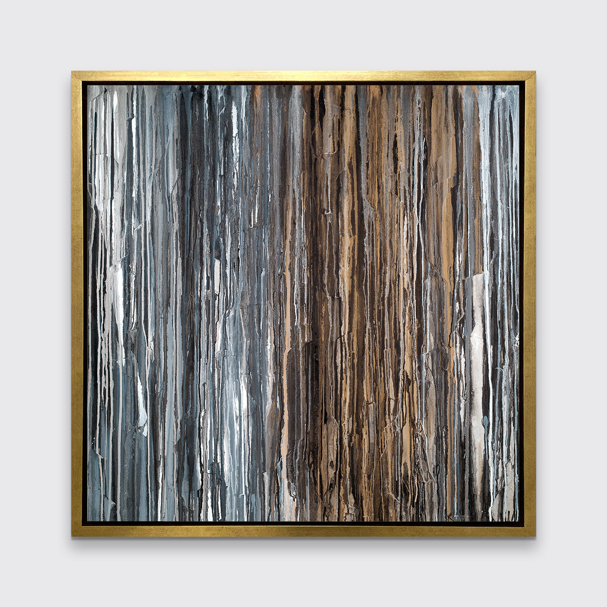 A brown, copper, white, grey and black abstract print in a gold floater frame hangs on a white wall.