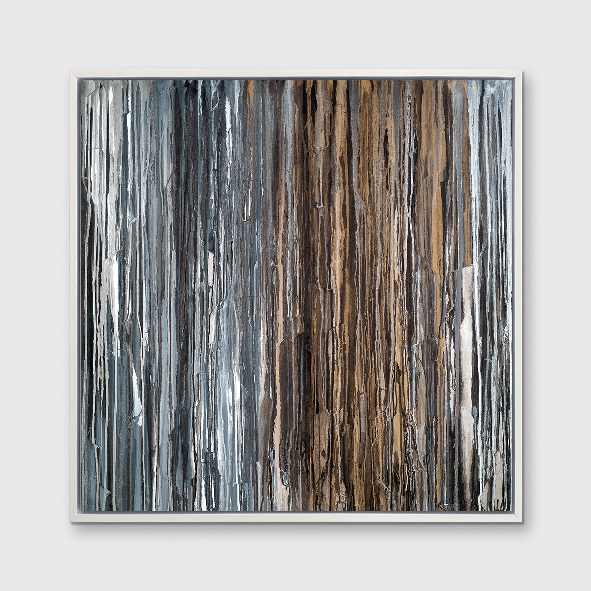 A brown, copper, white, grey and black abstract print in a white floater frame hangs on a white wall.