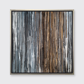 A brown, copper, white, grey and black abstract print in a silver floater frame hangs on a white wall.
