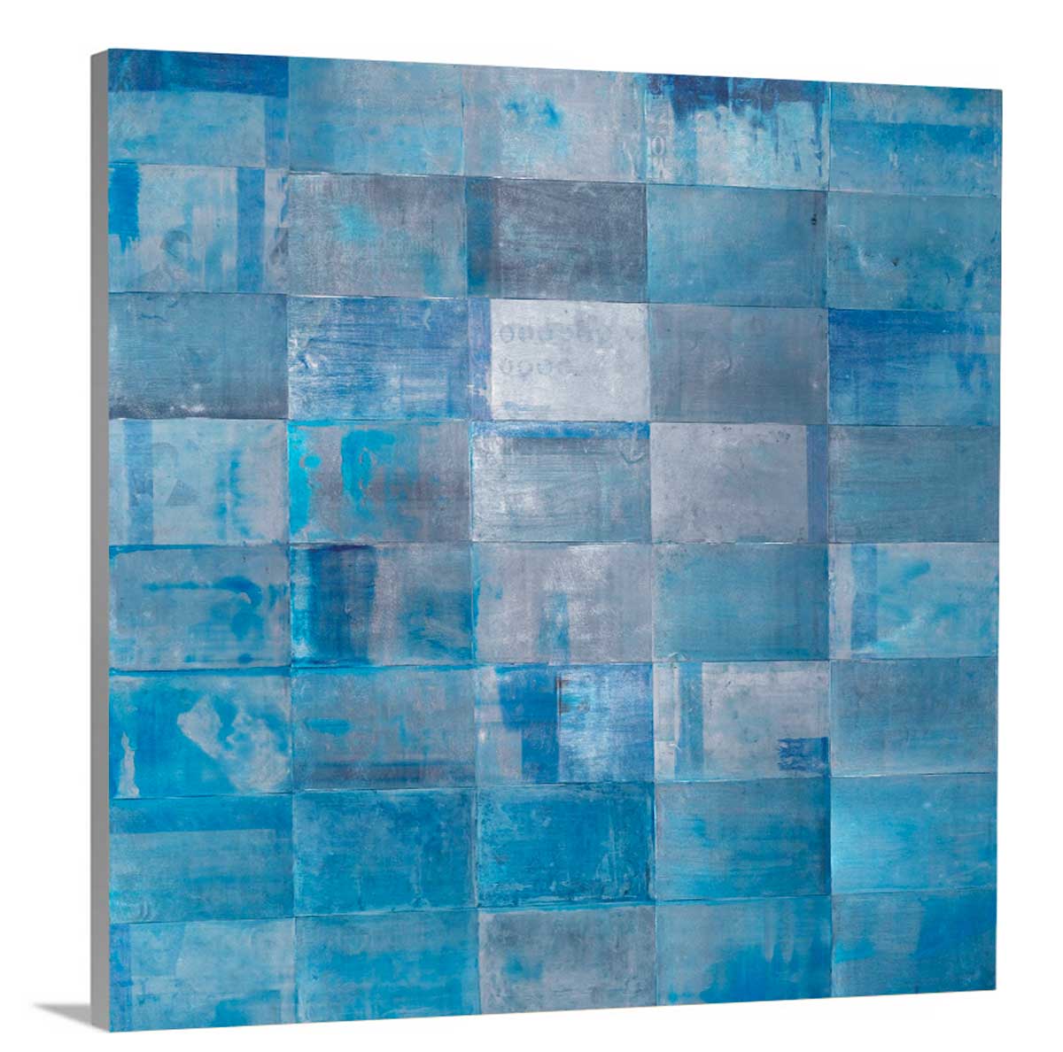A side-angle view of a blue geometric print with grey accents on canvas.