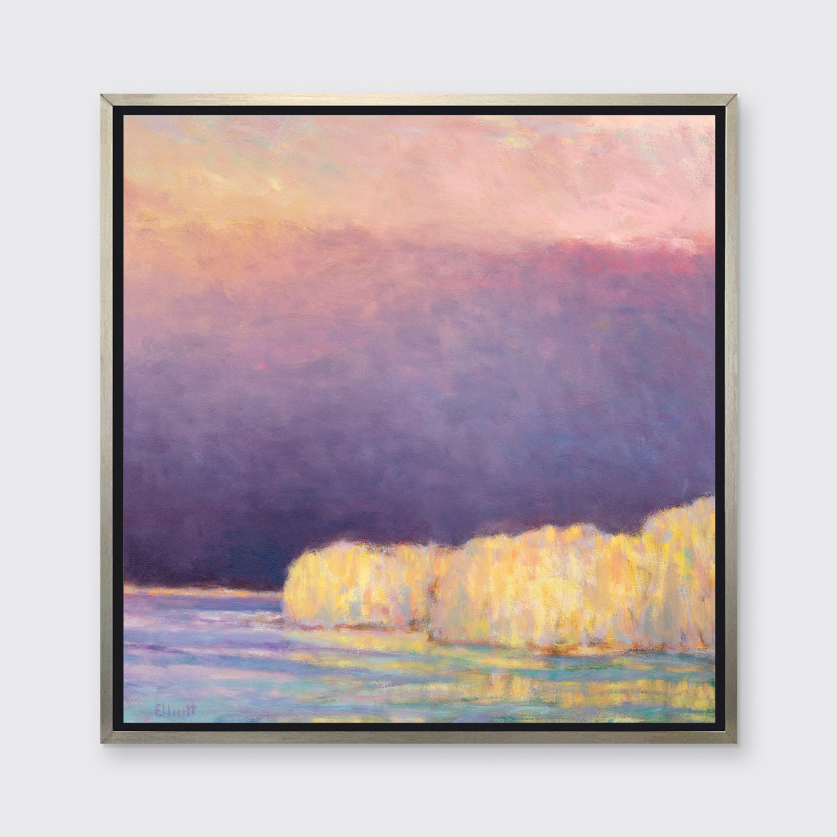 A violet, pink, yellow and light blue abstract landscape print in a silver floater frame hangs on a white wall.