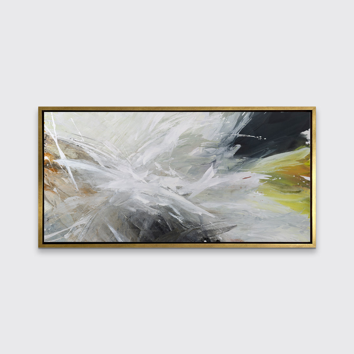 A white, black, grey and gold abstract print in a gold floater frame hangs on a white wall.