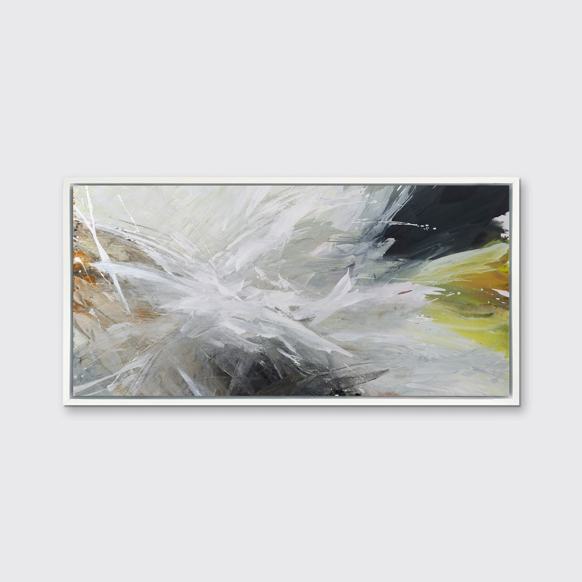 A white, black, grey and gold abstract print in a white floater frame hangs on a white wall.