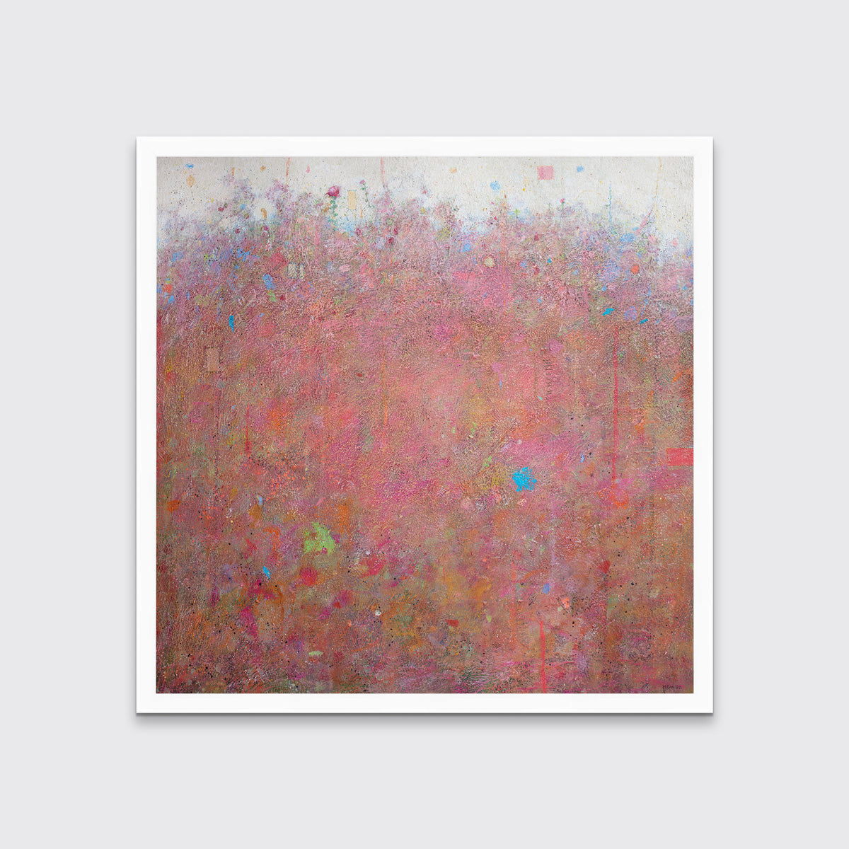 A red abstract landscape print in an unmatted white frame hangs on a white wall.