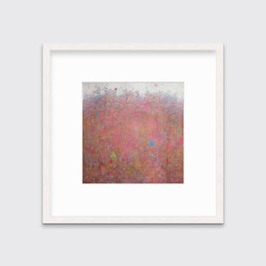A red abstract landscape print in a whitewashed frame with a mat hangs on a white wall.