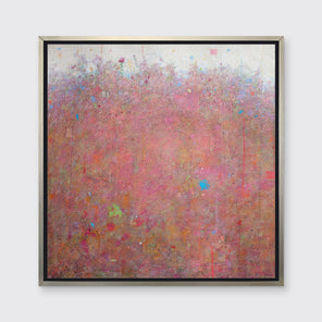 A red abstract landscape in a silver floater frame hangs on a white wall.