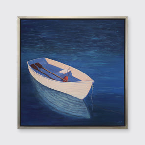 A blue, beige and lavender contemporary coastal print of a boat wading in the water in a silver floater frame hangs on a white wall.