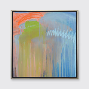 A blue, orange and green abstract print in a silver floater frame hangs on a white wall.