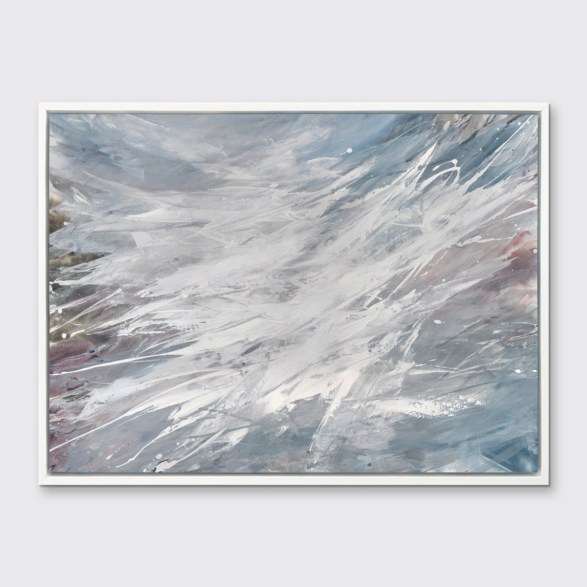 A grey, white and blue abstract print in a white floater frame hangs on a white wall.