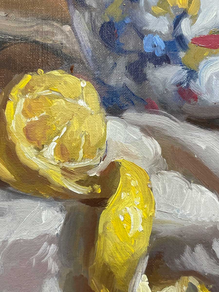 Detailed close of up of vase and peeled lemon in hyperrealist painting.