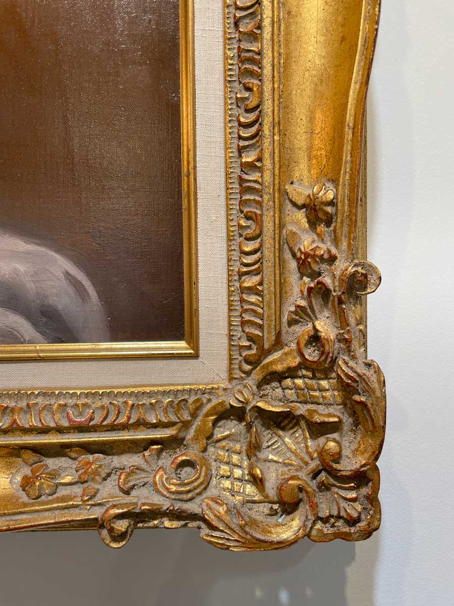 Detailed, close up of the corner of gold frame.