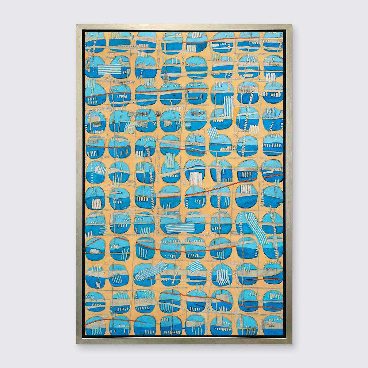 An orange, blue and light blue abstract print in a silver floater frame hangs on a white wall.