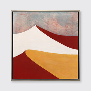 A dark red, white, dark yellow and teal abstract landscape print in a silver floater frame hangs on a white wall.