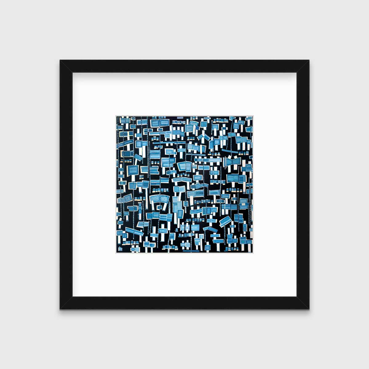 A blue, white and black abstract print in a black frame with a mat hangs on a white wall.