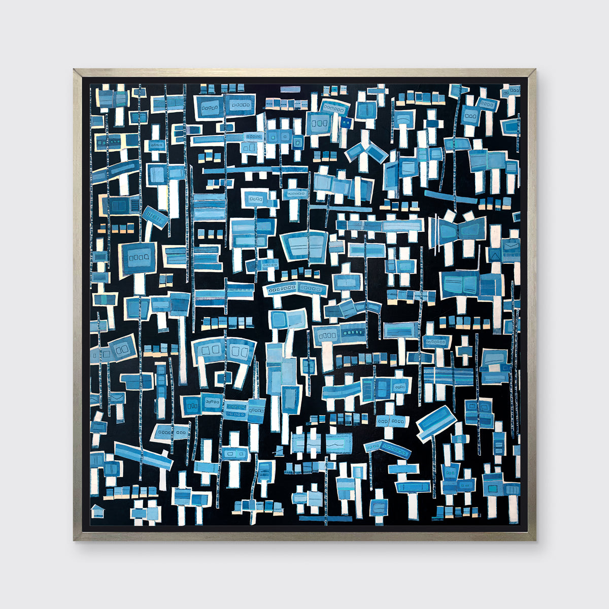 A blue, white and black abstract print in a silver floater frame hangs on a white wall.
