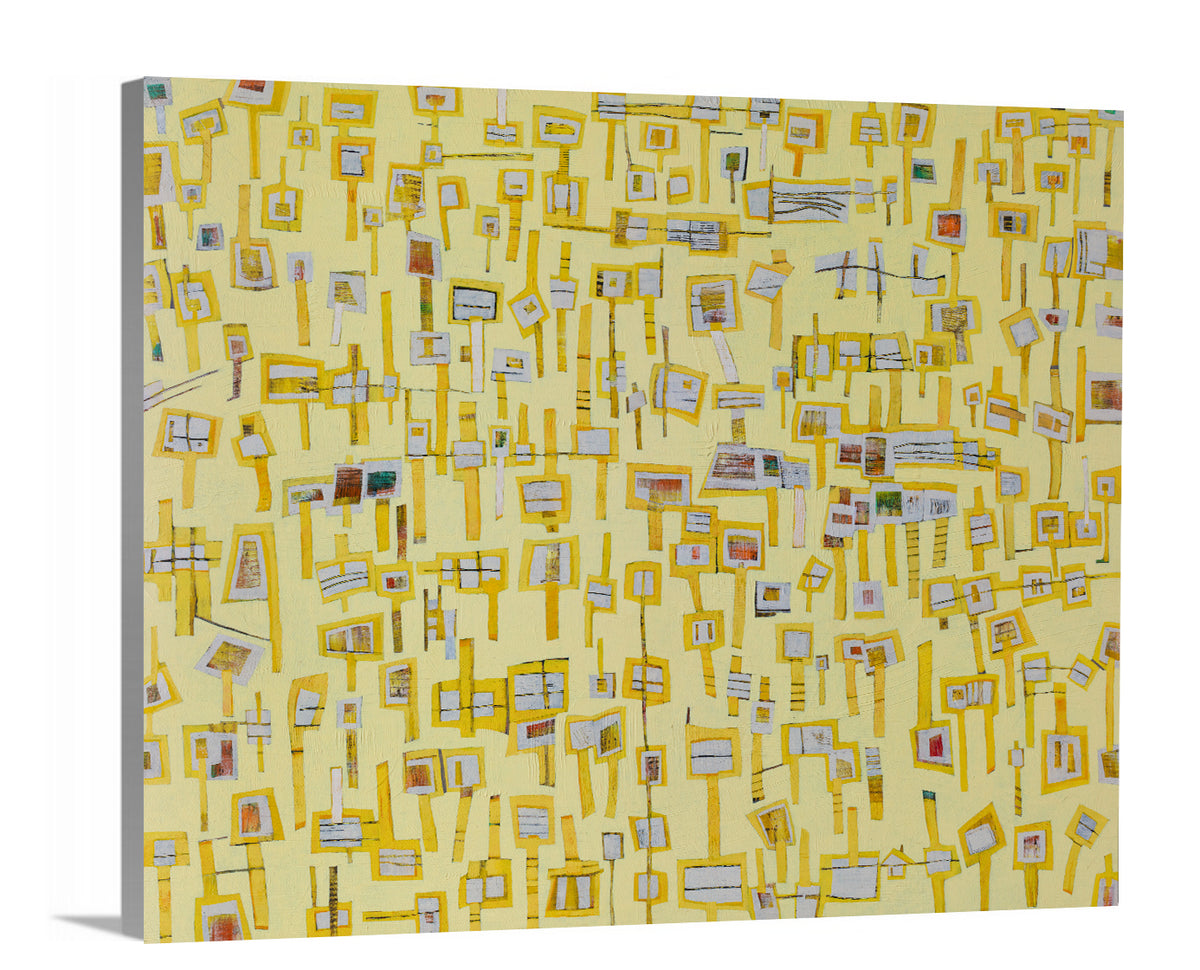 A side-angle view of a yellow and grey abstract print on canvas.
