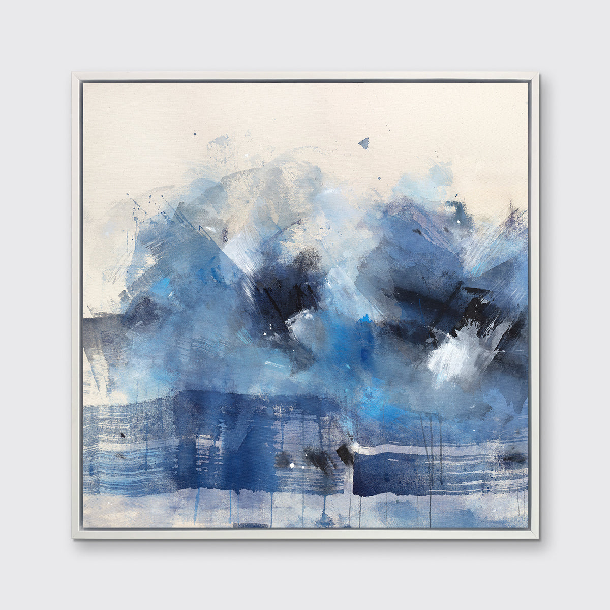 A blue, beige, white and black abstract print in a white floater frame hangs on a white wall.