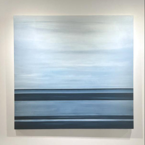 A tonal blue linear abstract painting by Tony Iadicicco hangs on a white wall.