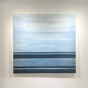 A tonal blue linear abstract painting by Tony Iadicicco hangs on a white wall.