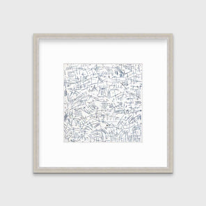 A white and blue abstract print in a silver frame with a mat hangs on a white wall.