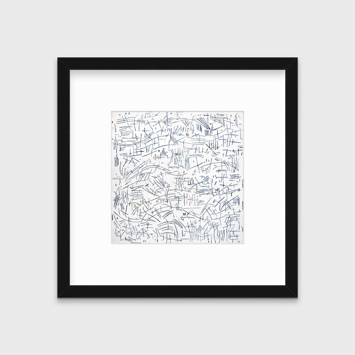 A white and blue abstract print in a black frame with a mat hangs on a white wall.