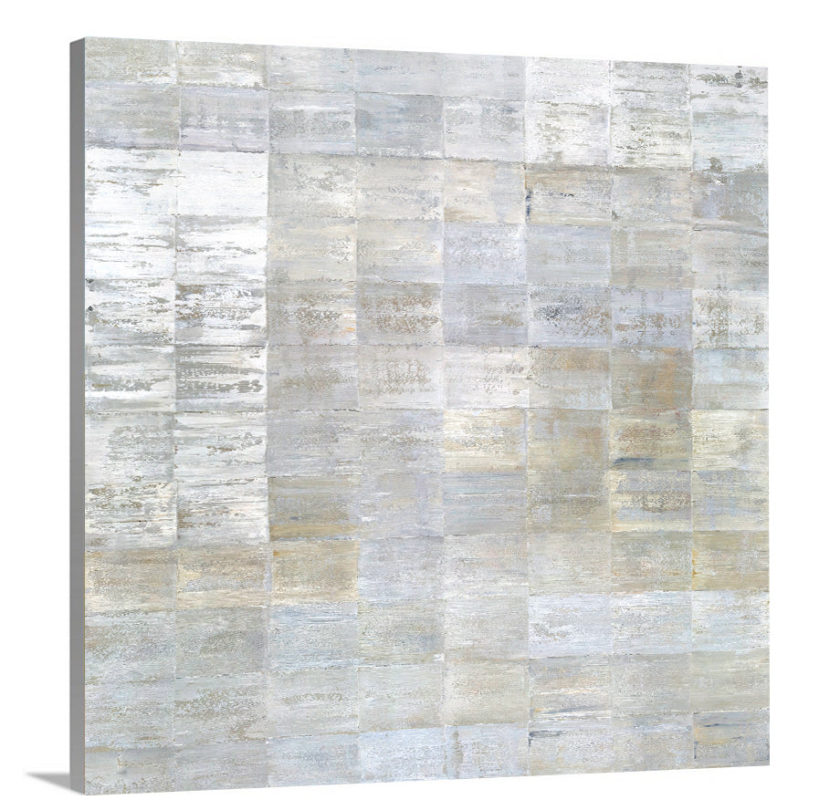 A side-angle view of a grey, silver and light gold abstract geometric print on canvas.