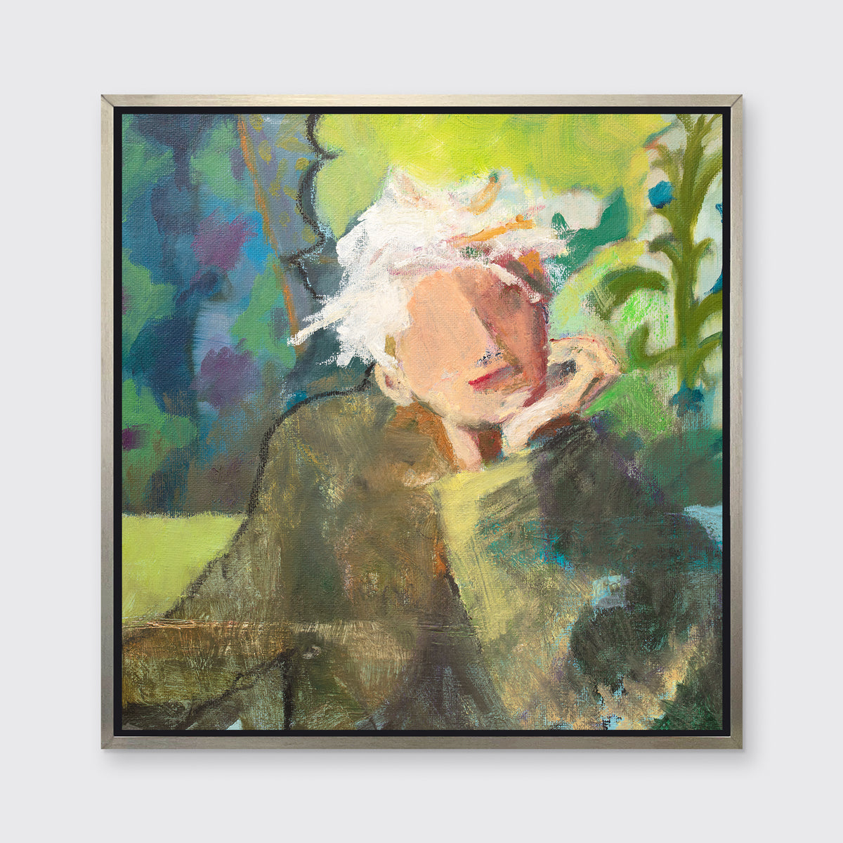 A green, beige and white abstract figural print in a silver floater frame hangs on a white wall.