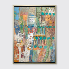 An abstract multicolored print framed in a warm silver floater frame hanging on a white wall.