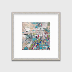 A turquoise, green, beige and pink abstract print in a silver frame with a mat hangs on a white wall.