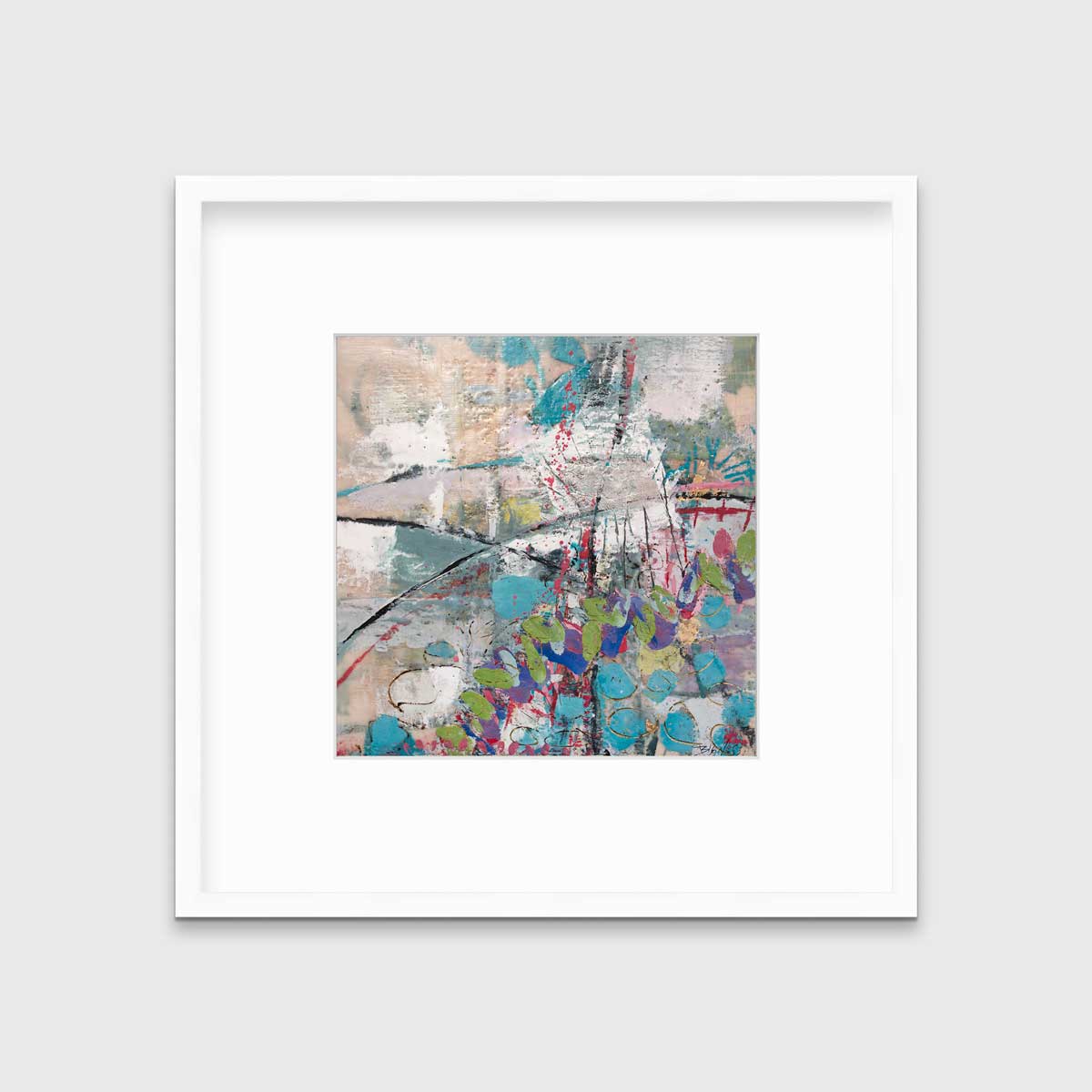 A turquoise, green, beige and pink abstract print in a white frame with a mat hangs on a white wall.