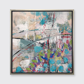 A turquoise, green, beige and pink abstract print in a silver floater frame hangs on a white wall.