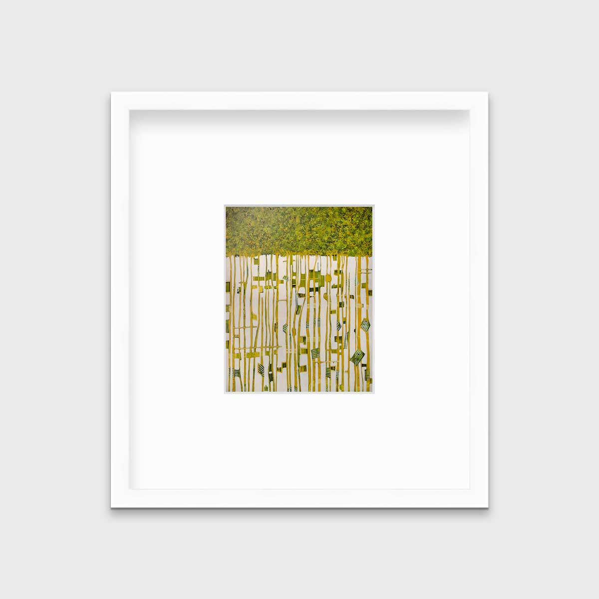 A green, yellow and white abstract print in a white frame with a mat hangs on a white wall.